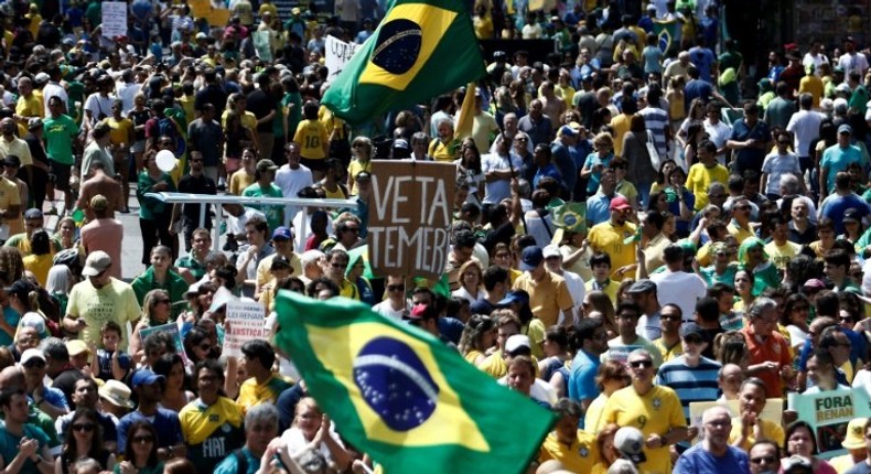 Demonstrators protest along Paulista Avenue in Sao Paulo, Brazil