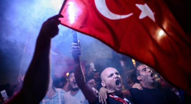 Supporters of President Recep Tayyip Erdogan rally in Istanbul's Taksim Square in July 2016 following a failed coup