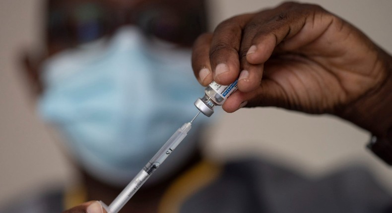 In this Wednesday, July 28, 2021 file photo, a health worker administers a dose of Janssen COVID-19 vaccine by Johnson & Johnson in the Medina neighborhood in Dakar, Senegal.
