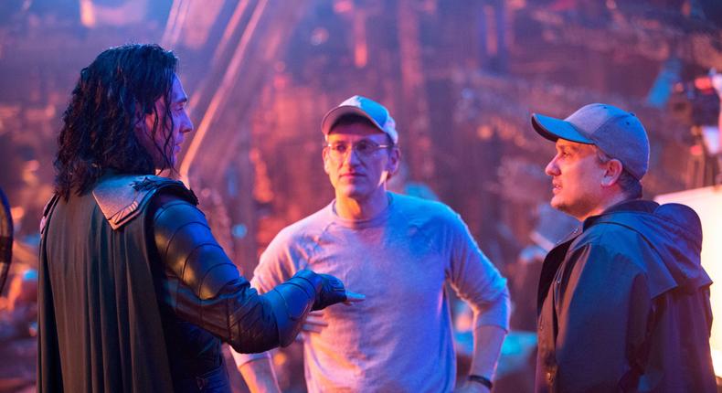 The Russo Brothers (Joe and Anthony Russo) alongside Tom Hiddleston on the set of Avengers: Infinity War.