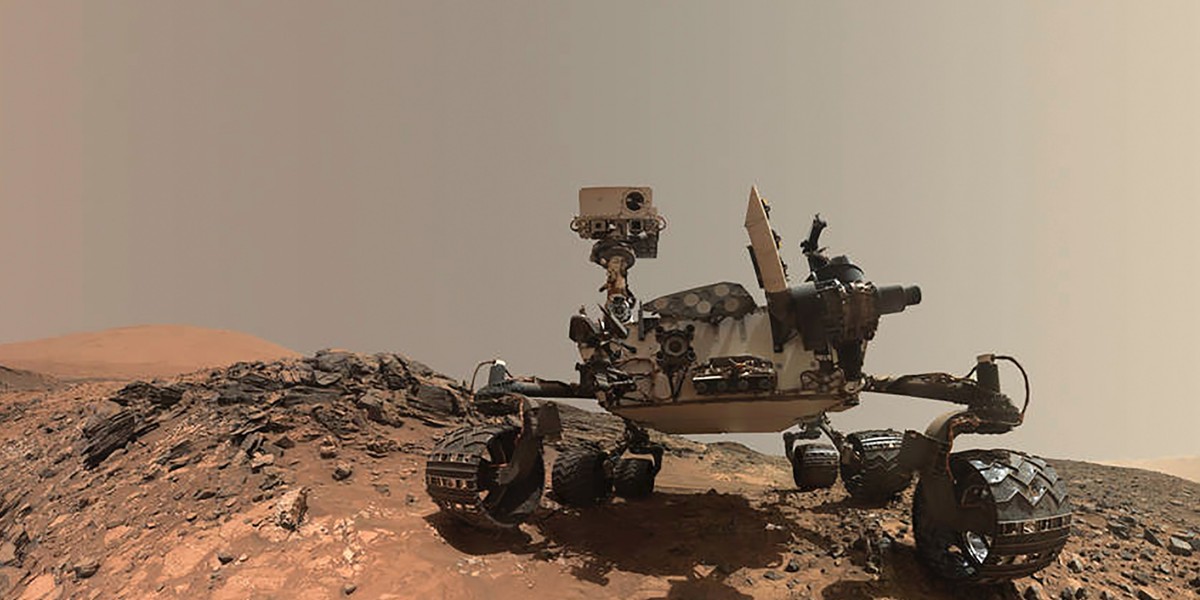 NASA's Curiosity Mars rover is seen at the site from which it reached down to drill into a rock target called 'Buckskin' on lower Mount Sharp in this low-angle self-portrait taken Aug. 5, 2015 and released Aug. 19, 2015.