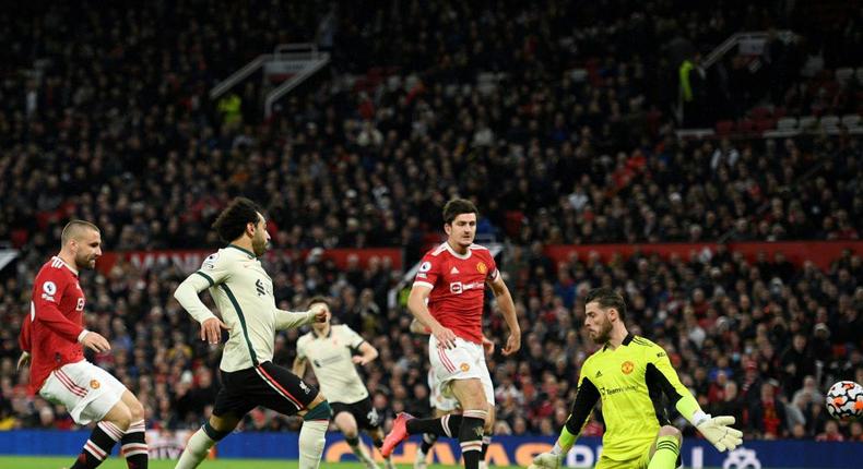 Liverpool forward Mohamed Saleh (2L) completes his hat-trick against Manchester United at Old Trafford on Sunday. Creator: Oli SCARFF