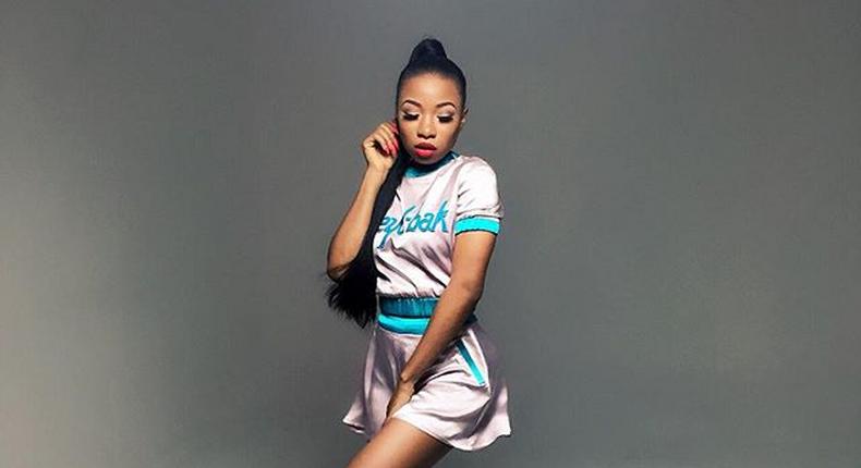 Mo'Cheddah in a look by Clan for one of her music videos