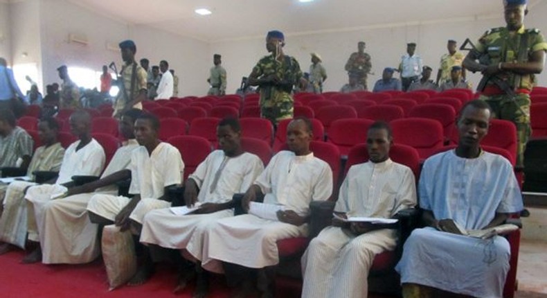 A picture taken Aug. 26, 2015 shows suspected members of Boko Haram sitting in court in N'Djamena.