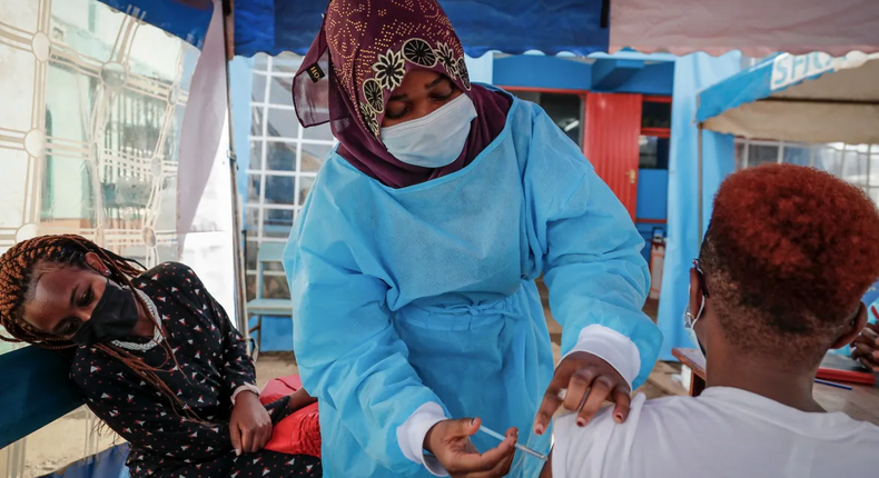A nurse administers an AstraZeneca vaccination in Kibera, Kenya, on Jan. 20. (Brian Inganga/The Associated Press)