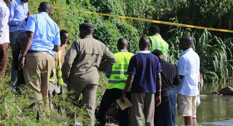 Police detectives and crime forensic officers at a crime scene in the past. 