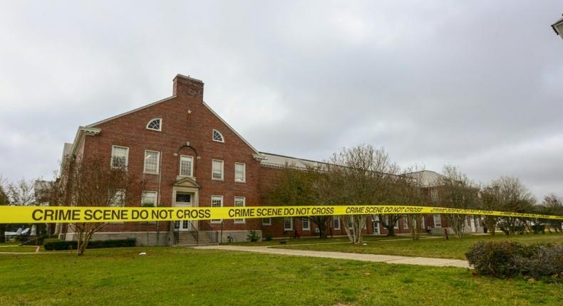 Police tape cordons off an area after a shooting at the Pensacola Naval Air Station in December 2019