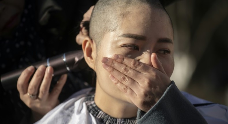 Li Wenzu shaved her head in 2018 in protest at the jailing of her husband Wang Quanzhang during the 709 crackdown