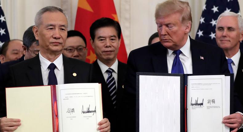 President Donald Trump holds the signed a trade agreement with Chinese Vice Premier Liu He, in the East Room of the White House, Wednesday, Jan. 15, 2020, in Washington.