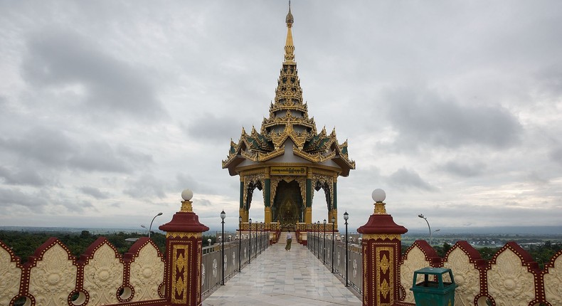 A Burmese man walks to a small temple at the Uppatasanti Pagoda in Naypyitaw, Burma.