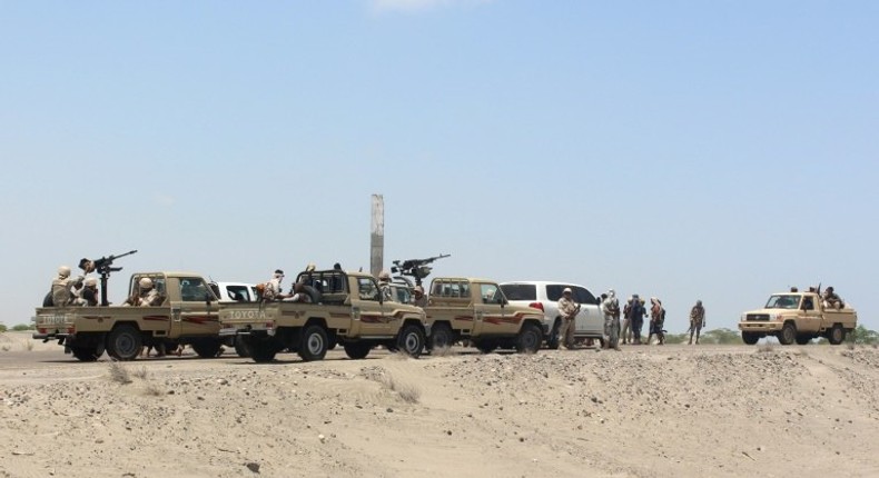 Forces loyal to the Saudi-backed Yemeni president stand guard on a road at the entrance to Abyan province in April 2016