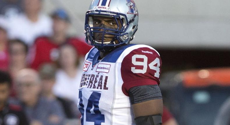 Montreal Alouettes' Michael Sam watches the play against the Ottawa Redblacks during first half CFL football action in Ottawa August 7, 2015. Sam, who last year became the first openly gay player drafted by a National Football League team, said on Friday he was stepping away from football, citing concerns over his mental health. The Canadian Football League's Montreal Alouettes, with whom he signed a contract in May, said on its team website that Sam had left the team for personal reasons and as a result had been placed on the team's suspended list. Picture taken August 7, 2015.  REUTERS/Christinne Muschi