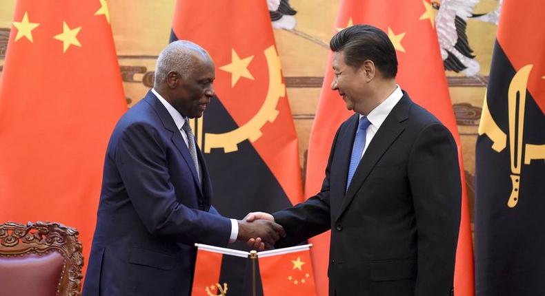 Angola's President Jose Eduardo dos Santos (L) shakes hands with China's President Xi Jinping during a signing ceremony at the Great Hall of the People in Beijing, June 9, 2015. REUTERS/Wang Zhao/Pool