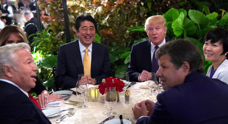 Trump and first lady Melania with Japanese Prime Minister Shinzo Abe, and his wife Akie Abe, at Mar-a-Lago in February, 2017. Robert Kraft, owner of the New England Patriots is seated at left.