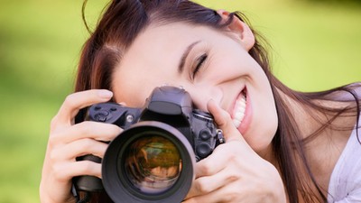 Beautiful girl with camera