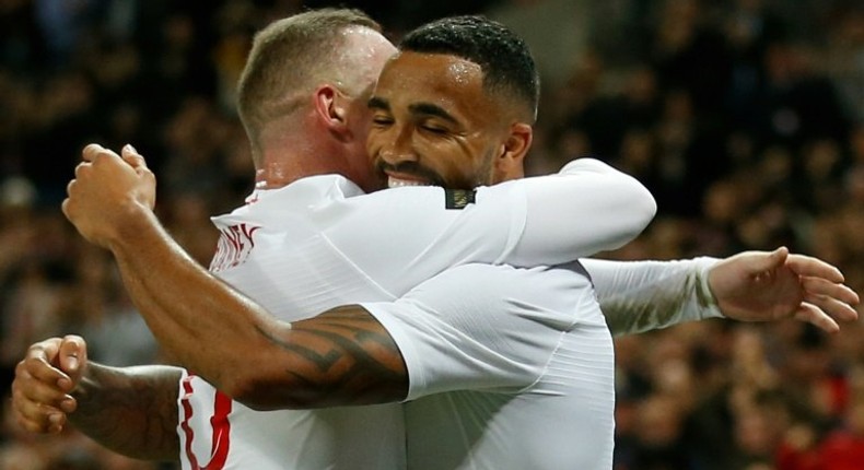 Wayne Rooney (left) celebrates with Callum Wilson (right) after Wilson scored his first international goal against the USA