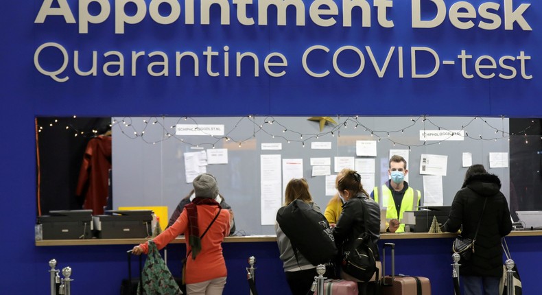 People wait in front for quarantine and COVID-19 test appointments inside Schiphol Airport in the Netherlands in November 2021.