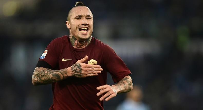 Roma's Radja Nainggolan celebrates after scoring during the Serie A match against Lazio at the Olympic Stadium in Rome, on December 4, 2016