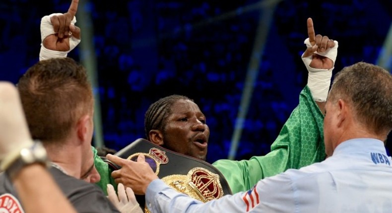 Hassan N'Dam (C) wins the World Boxing Association middleweight title on a split decision despite having been knocked down by Ryoya Murata