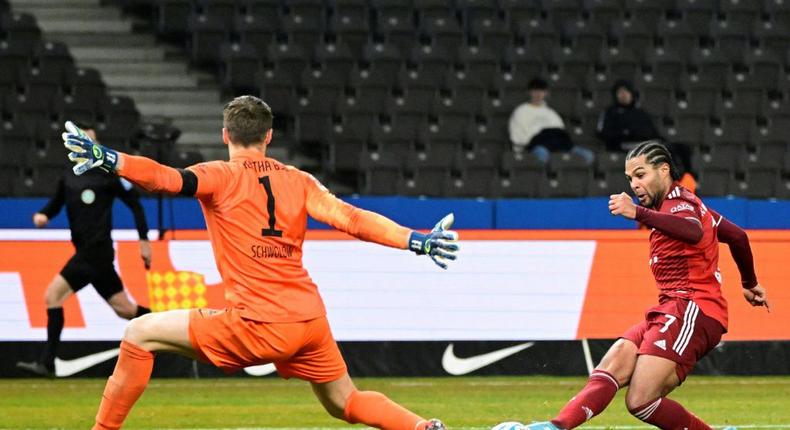 Bayern Munich winger Serge Gnabry (R) scores their fourth goal at Hertha Berlin on Sunday Creator: Tobias SCHWARZ