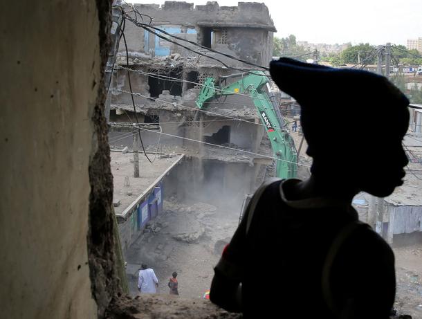 The Wider Image: Tearing down condemned homes in Nairobi