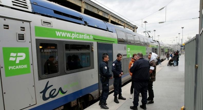 French policemen patrol on a platform at the Gare du Nord train station in Paris on April 22, 2017, after a man carrying a knife was arrested