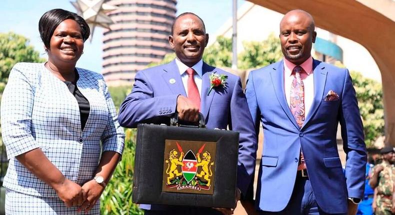 Treasury CS Ukur Yatani with National Assembly Budget committee chairman Kanini Kega and National Assembly’s Finance committee chairperson Gladys Wanga