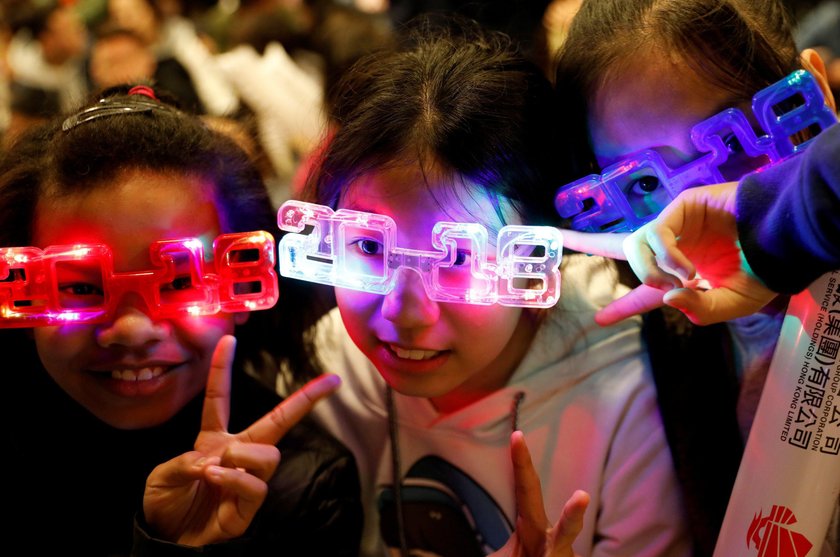 Participants dressed up as foxes attend the New Year's countdown event before they parade for the fi