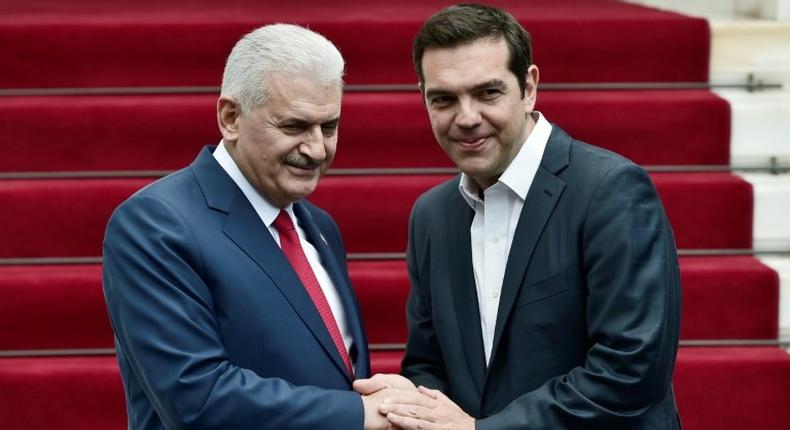 Greek Prime Minister Alexis Tsipras (left) and his Turkish counterpart Binali Yildirim struck a positive note after their talks in Athens Monday