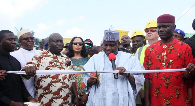 Governor Aminu Waziri of Sokoto State cutting the tape to formally flag off the Umuocham-Umule-Umuehilegbu road built by Abia State government in Aba .