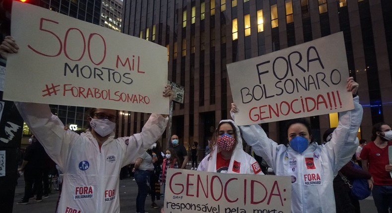 Demonstrators gather with signs and flags during a protest against President Jair Bolsonaro's administration on June 19, 2021 in Sao Paulo, Brazil
