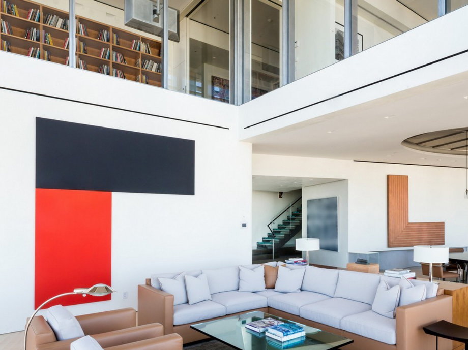The modern, two-story penthouse is bright and light-filled.