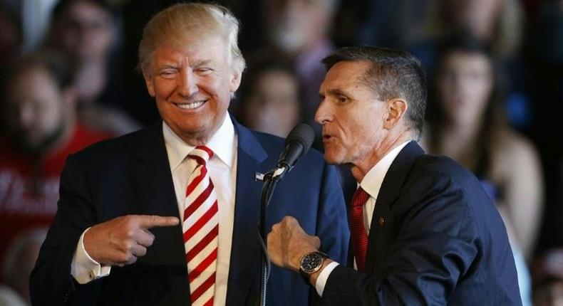 Donald Trump and Michael Flynn speak at a rally in Colorado in October