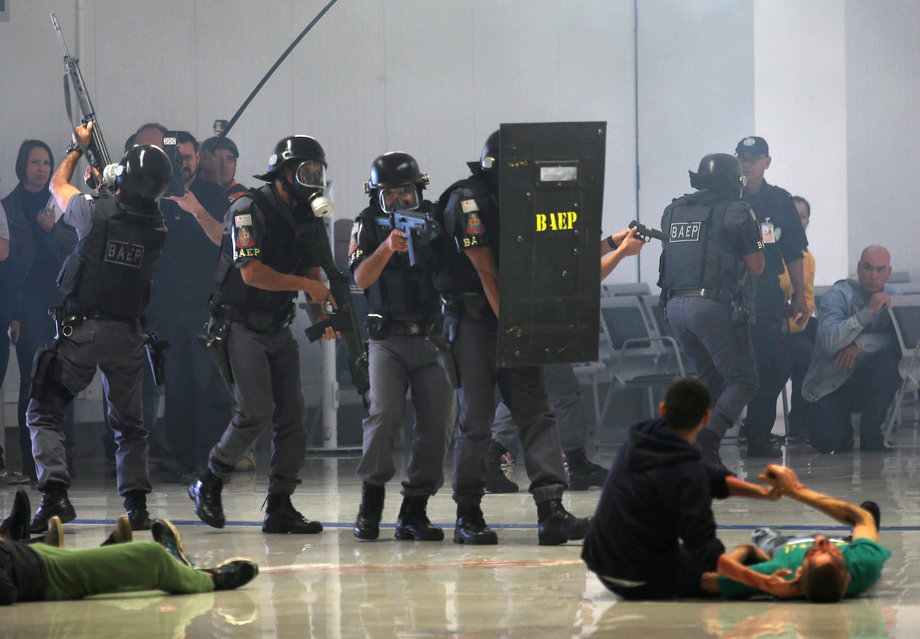 Sao Paulo state police take part in a simulated hostage situation during a security exercise ahead of the 2016 Rio Olympics, in the airport of Sao Jose dos Campos, Brazil, July 21, 2016.