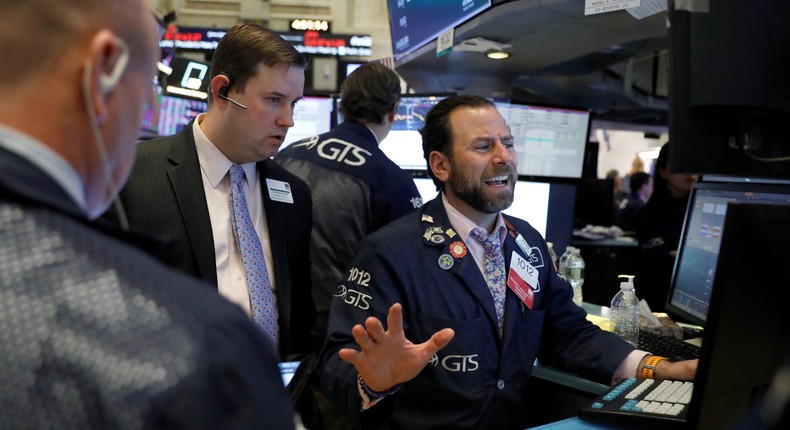 Traders work on the floor at the New York Stock Exchange (NYSE) in New York City, U.S., March 5, 2020.