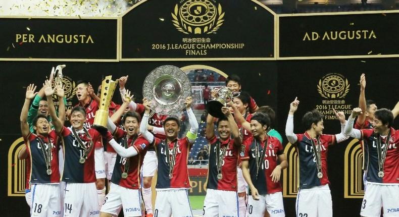 Kashima Antlers players celebrate their victory over Urawa Reds after the J-League Championship final in Saitama, on December 3, 2016