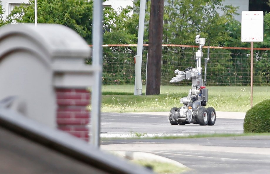 Dallas Police use a robot to gain access to an armored van in June 2015.