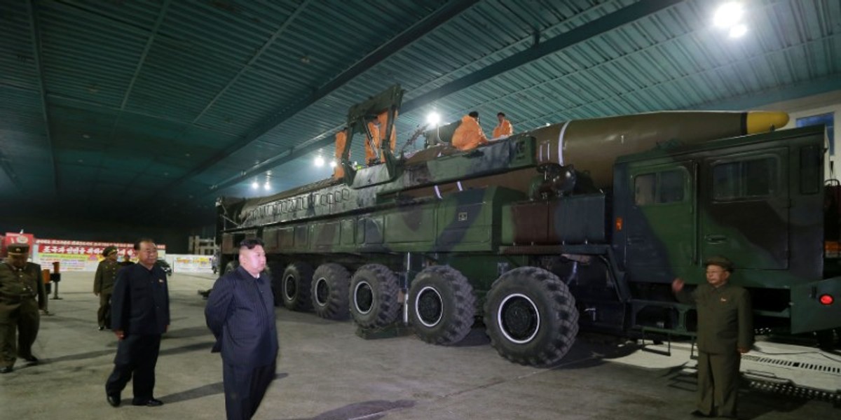 North Korean leader Kim Jong Un inspects the intercontinental ballistic missile Hwasong-14 in this undated photo released by KCNA.