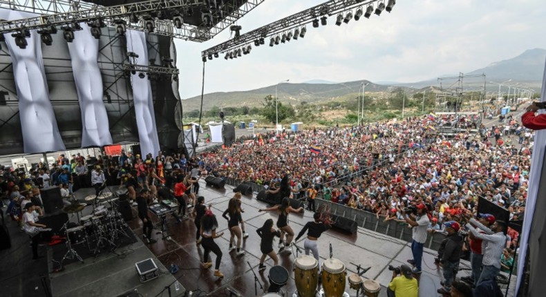 People attend the three-day pro-regime concert called by Venezuela President Nicolas Maduro to rival a charity music festival organized by British entrepreneur Richard Branson, on the Venezuelan side of the Tienditas International Bridge