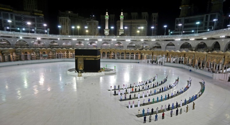 A handful of worshippers pray at the Islam's holiest shrine, the Grand Mosque complex in Saudi Arabia's holy city of Mecca, usually teeming with pilgrims as the annual hajj pilgrimage approaches