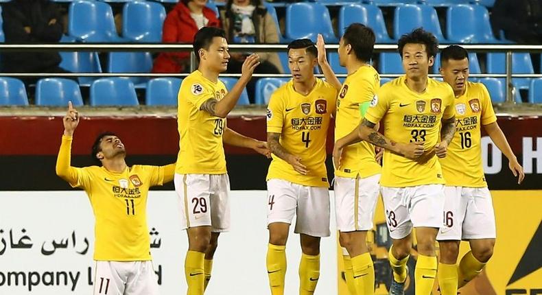 China's Guangzhou Evergrande players celebrate after scoring a goal during an AFC Champions League match in Pohang, South Korea