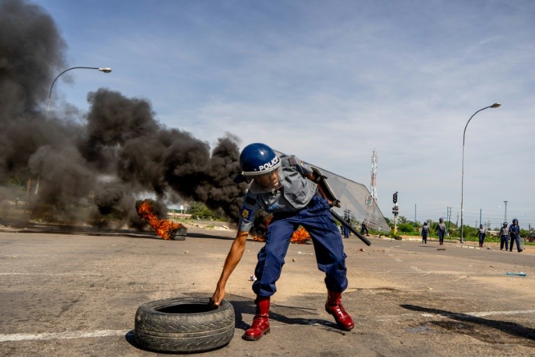 In the city of Bulawayo, demonstrators attacked minibuses heading to the city centre and used burning tyres and stones to block the main routes into town