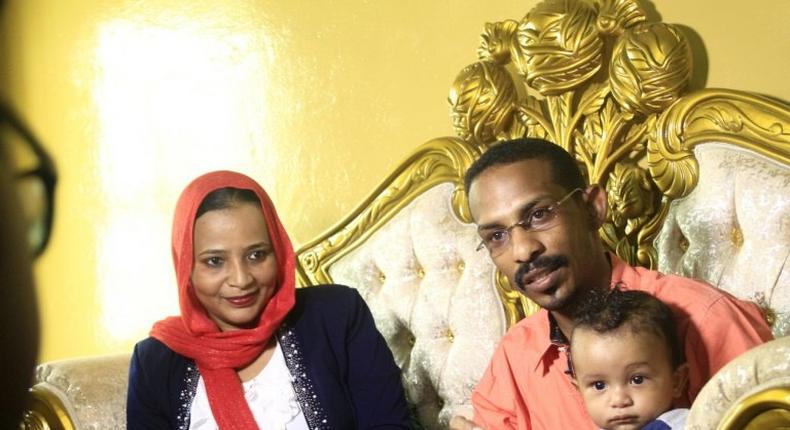 Sudanese family emigrating to the US, Mohamed al-Khatim (R), his wife Samah al-Amin (L) and their eight month old son are seen in Khartoum on February 10, 2017