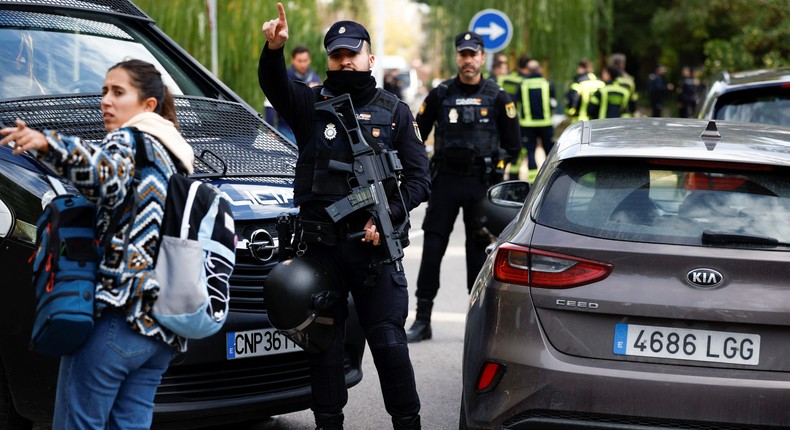 Spanish police stand outside of the Ukrainian embassy after a blast at the building injured one employee who was handling a letter in Madrid, Spain.Reuters