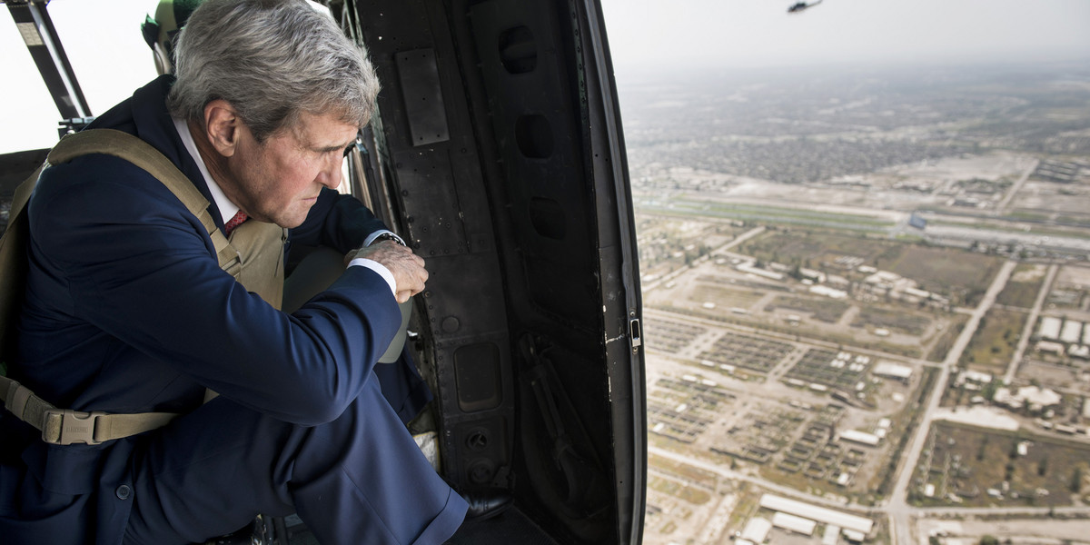 US Secretary of State John Kerry looks out over Baghdad from a helicopter on September 10, 2014.