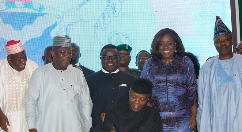 Acting President Yemi Osinbajo signing the executive order on Voluntary Assets and Income Declaration Scheme (VAIDS) at the State House Conference Centre, Abuja on Thursday, June 29, 2017