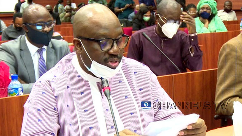 In this photo taken on July 14, 2020, acting Managing Director of the NDDC, Professor Kemebradikumo Pondei, reads from a paper during the agency’s 2019 budget defence at the National Assembly in Abuja. [channelstv]