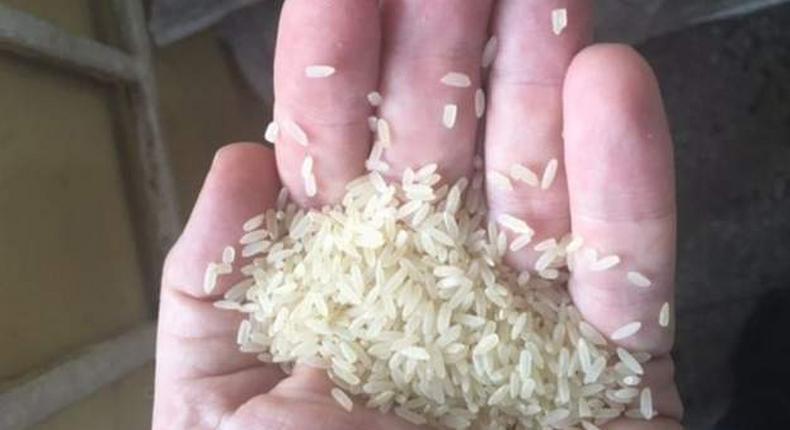 BBC journalist Martin Patience handling the plastic rice