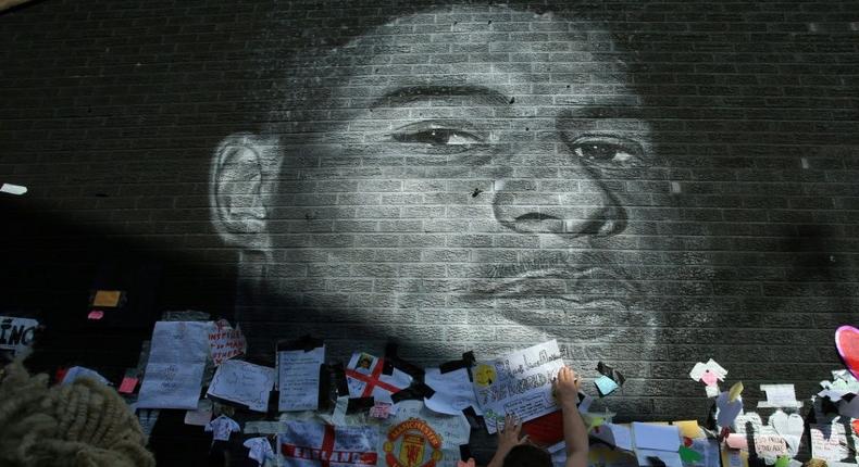 Messages of support adorn a mural of Manchester United and England forward Marcus Rashford after it was defaced Creator: Lindsey Parnaby
