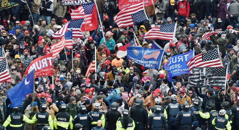 Trump supporters clash with police and security forces as they storm the US Capitol in Washington, DC on January 6, 2021.
